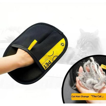 Pet owner wearing an electrostatic grooming glove to remove fur from a dog